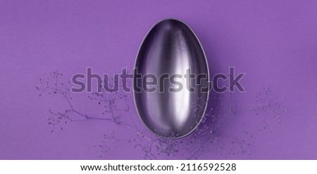 Golden Easter Egg in row placed on yellow background. Easter background or easter concept. copy space