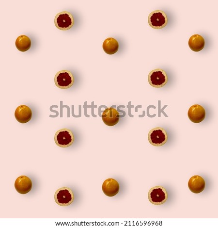 Colorful fruit pattern of fresh grapefruits on pink background. Top view. Flat lay. Pop art design