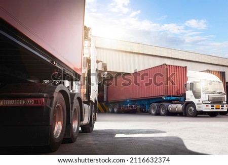 Semi Trailer Trucks Parked Loading at Dock Warehouse. Shipping Cargo Containes. Distribution Warehouse Center. Lorry.  Industry Freight Trucks Cargo Transport Logistics.	
 Royalty-Free Stock Photo #2116632374