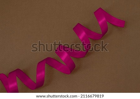 Image of a gift made of pink ribbon