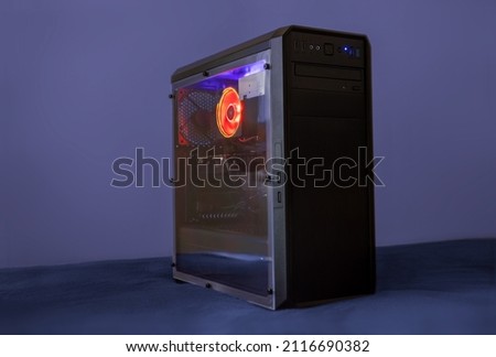Gaming computer with LEDs on a desk Royalty-Free Stock Photo #2116690382