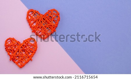 Top view of two red hearts on color background. Valentines day symbol. Space for text. 