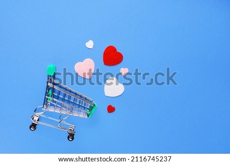 Valentine's day composition with notebook list and hearts on blue background. Wedding, birthday, woman's and mother day concept. Flat lay, top view, copy space, place for text, empty, mock up