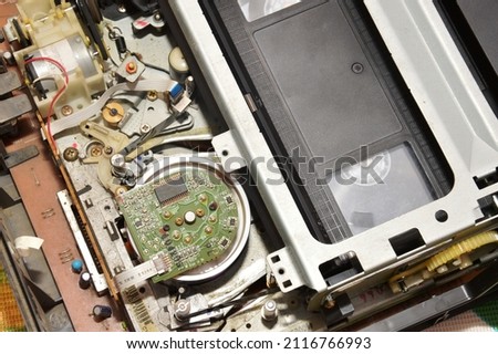 The process of loading a videotape and VCR and playing and rewinding the cassette