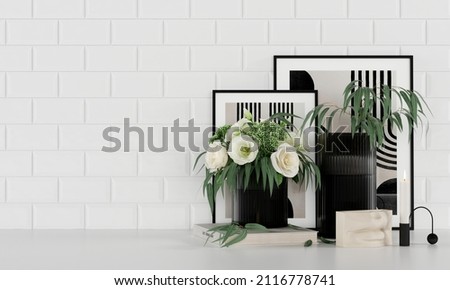 Interior Decor. Bouquet of flowers in a vase, books, candlestick, paintings. On the background of white tiles.