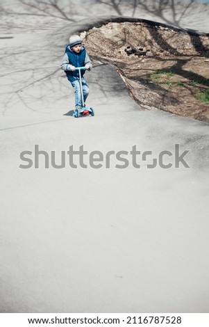 little boy riding scooter game