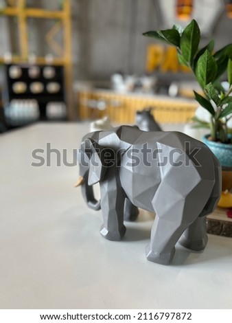 A  beautiful picture consisting of an elephant vase shining in the evening sun