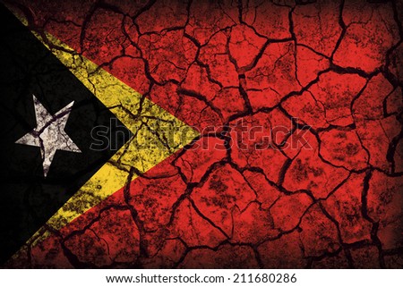 East Timor flag pattern on the crack soil texture ,retro vintage style