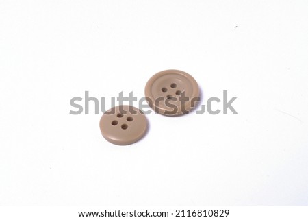 Buttons on white background. Element of men's clothing. Sleeve with buttons men's suit