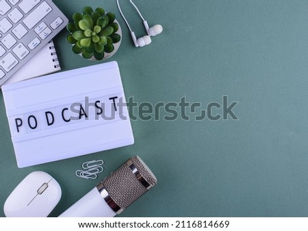 Podcast new episode concept. Workplace desk of blogger or podcaster with microphone