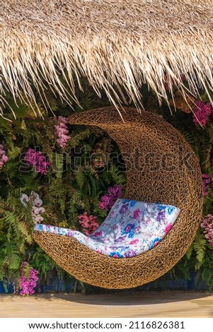 Cozy place with a swing with a mattress in a tropical garden on the island of Koh Phangan, Thailand Royalty-Free Stock Photo #2116826381