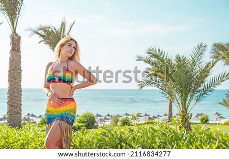 Vacation scene. Panoramic views of blue sea and coastline. Beautiful landscape, aerial view, Egypt. Plus size woman enjoys view of coast of Red Sea. High quality photo