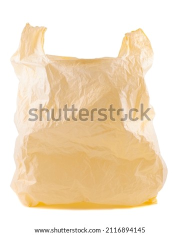 Plastic yellow bag empty. Plastic bags are the cause of major environmental concerns. Object is isolated on white isolated background without shadows