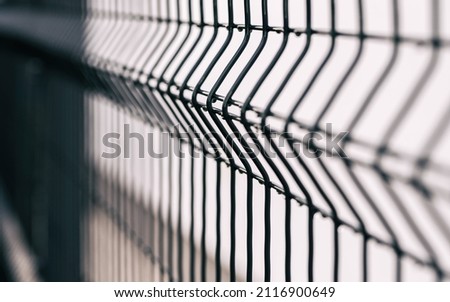 grating wire industrial fence . Panel fence  Royalty-Free Stock Photo #2116900649