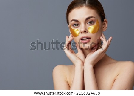 woman golden patches on the face isolated background