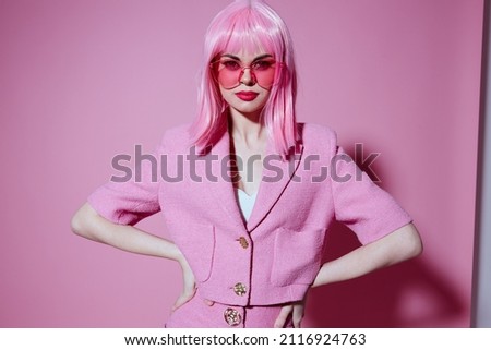 Positive young woman bright makeup pink hair glamor stylish glasses color background unaltered