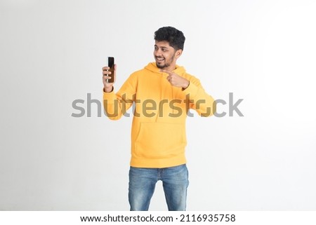 young man holding phone in white background with happy expression, sad and shocking 