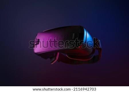 Metaverse. Future game and entertainment digital technology. VR virtual reality glasses isolated on dark blue purple background.