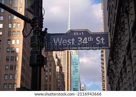 Blue West 34th Street on Broadway and Avenue of the Americas historic sign in Midtown Manhattan in New York City