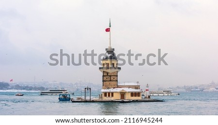 Snowy day in Uskudar. View of Maiden's Tower in Uskudar, Istanbul, Turkey. Royalty-Free Stock Photo #2116945244