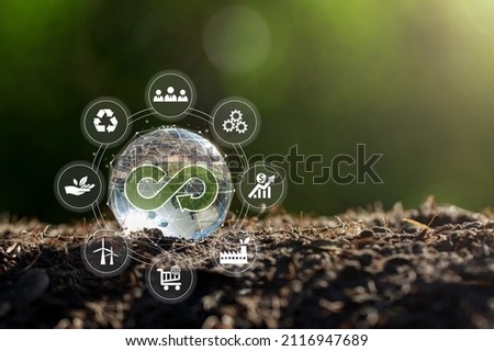 Circular economy concept.crystal globe with a circular economy icon around it.circular economy for future growth of business and design to reuse and renewable material resources.   Royalty-Free Stock Photo #2116947689