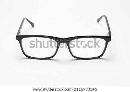Carbon fiber degree glasses in black color. Front view and white background. Space for text.