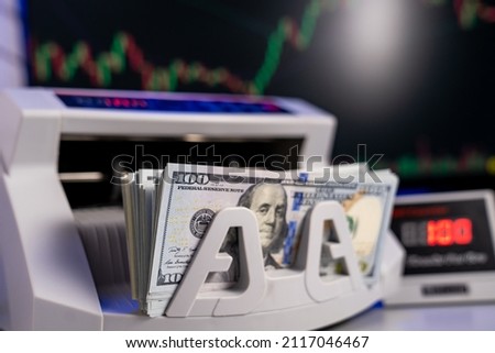 Calculation american banknotes. Financial banking device for counting dollars. Royalty-Free Stock Photo #2117046467