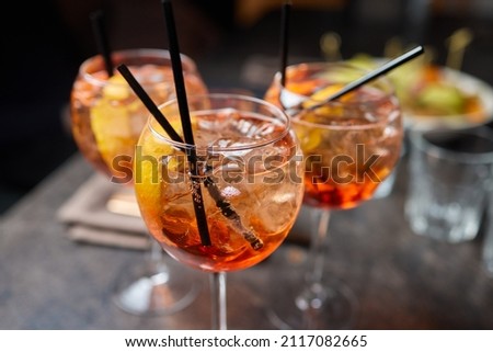 Italian cocktail with orange slices on gray stone table. Summer drink, homemade. Royalty-Free Stock Photo #2117082665