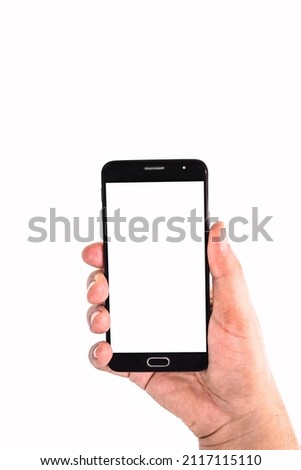 male hand holding cellphone black smartphone in horizontal position filming or photographing something , isolated white background, empty screen for mockup, copy space
