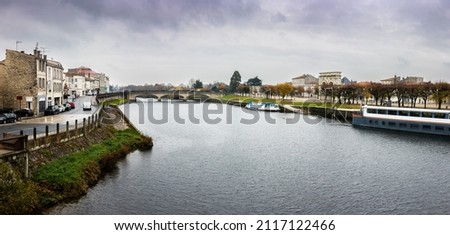 The ancient city of Saintes on the Charente river, in the province of Charente-Maritime in New Aquitaine in France. Santiago de Compostela route. Royalty-Free Stock Photo #2117122466