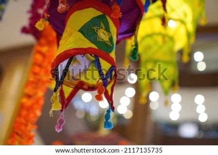A low angle shot of an Indian fabric lantern decoration during the Deepavali festival