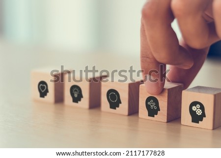 Digital skills concept. New skill, reskill for digital technology evolution. Soft skill,thinking skill, digital skill. Hand holds wooden cube with "digital skill" icon on white background, copy space. Royalty-Free Stock Photo #2117177828
