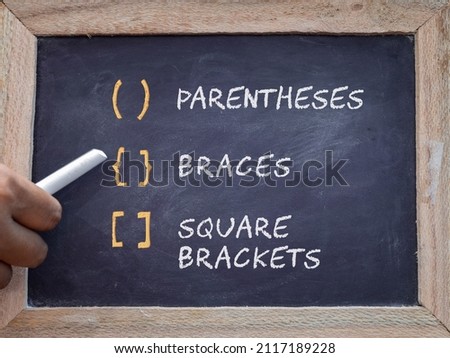 Different mathematical notations used for grouping on chalkboard. Education concept.  Royalty-Free Stock Photo #2117189228
