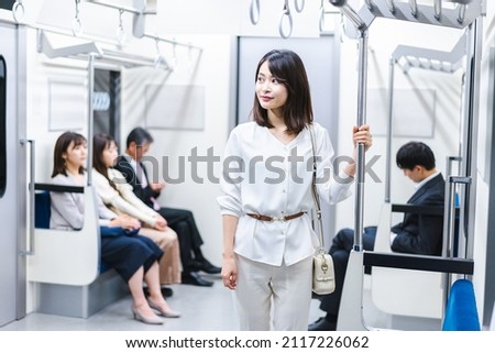 Young housewife going out on the train Royalty-Free Stock Photo #2117226062