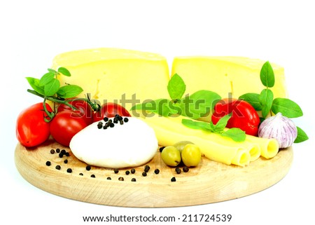 Cheese and tomatoes with garlic on white background