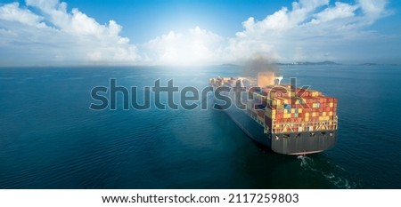 Banner,Stern of large cargo ship with Smoke exhaust gas emissions from cargo lagre ship ,Marine diesel engine exhaust gas from combustion. Freight Forwarding Service. Stern of large Container Vessel