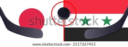 Top view hockey puck with Japan vs. Syria command with the sticks on the flag. Concept hockey competitions