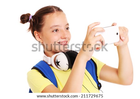 A picture of a schoolgirl taking pictures with her smartphone