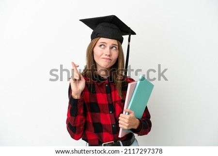 Young English student woman isolated on white background with fingers crossing and wishing the best