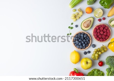 Fresh fruits and vegetables on grey background. Healthy eating concept. Flat lay, copy space. Royalty-Free Stock Photo #2117300651