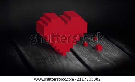 Red pixel heart on a wooden background. Gift card.