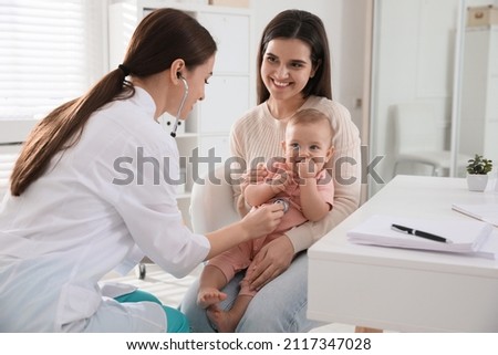 Mother with her cute baby visiting pediatrician in clinic Royalty-Free Stock Photo #2117347028