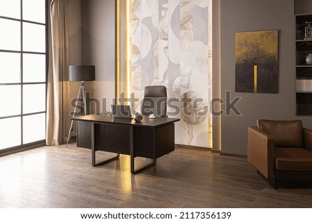 stylish luxury home office interior in an ultramodern brutal apartment in dark colors and cool led lighting Royalty-Free Stock Photo #2117356139