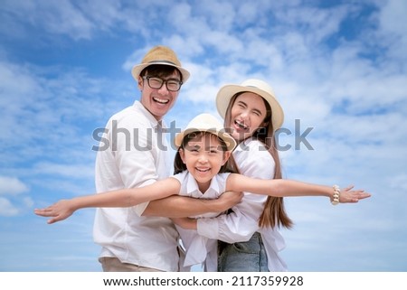 Asian family fun and play togather with blue sky background