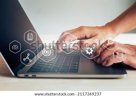 Businessman working with laptop, business analytics concept with digital data diagrams and chart, financial dashboard of company.
