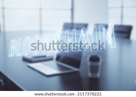 Double exposure of blockchain technology hologram on laptop background. Research and development decentralization software concept
