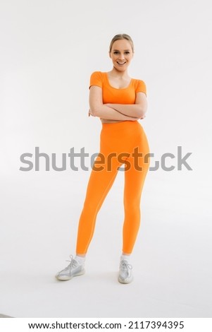 Powerful. Caucasian professional female athlete training isolated on white studio background. Muscular, sportive woman.
