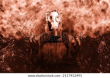 A shot of a man dressed in a gas mask, a jacket with a hood, a backpack, holding his hands in front of him as if there was something in them, looking into the camera. On background grunge