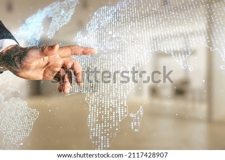 Multi exposure of businessman hand presses on abstract creative digital world map hologram on blurred office background, research and analytics concept
