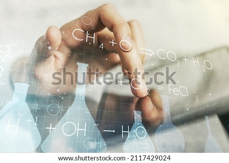 Creative chemistry illustration with finger presses on a digital tablet on background, science and research concept. Multiexposure